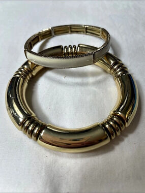 Gold tone stretch bracelet and Gold With Cream Enamel Stretch bracelet Both Brac